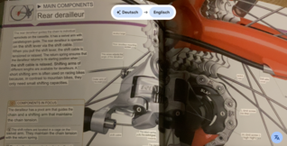 Mit Google Lens fotografierter Text über Fahrräder, der digitalisiert und in englisch übersetzt wurde